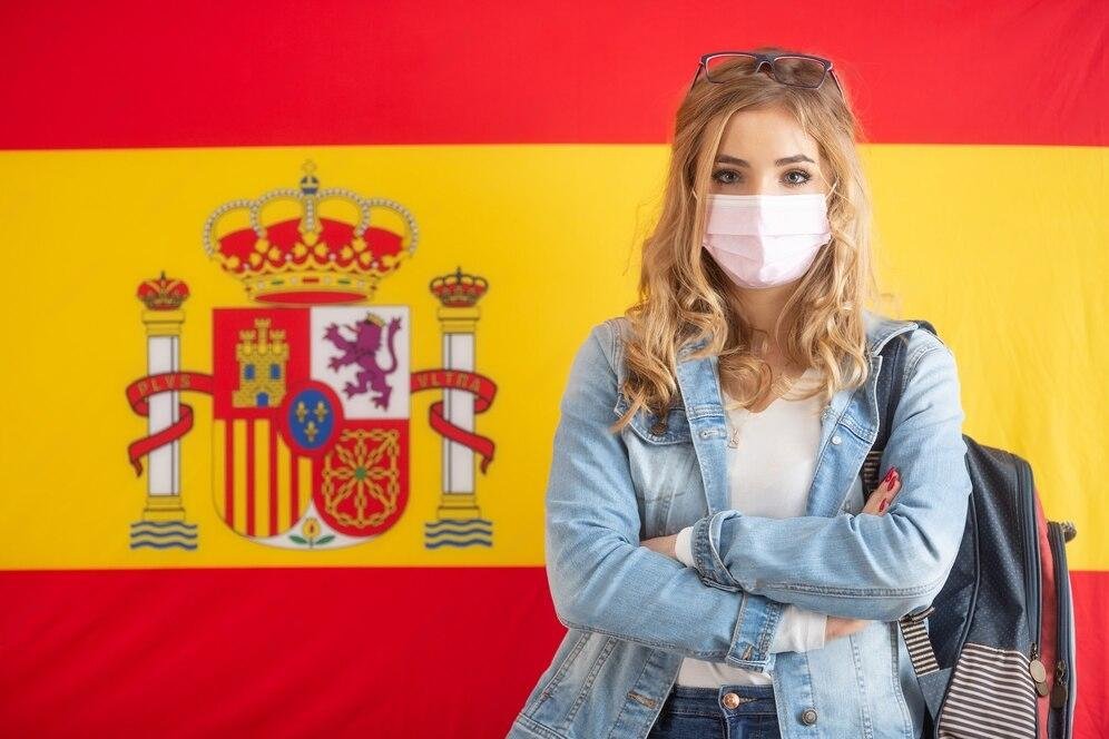 female-student-caryying-backpack-stands-front-spanish-flag-with-face-mask_341862-671-transformed female-student-caryying-backpack-stands-front-spanish-flag-with-face-mask_341862-671-transformed