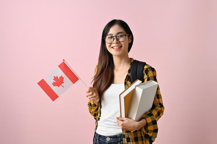 smiling-asian-female-college-student-holding-flag-canada-against-pink-isolated-background_67155-33062 smiling-asian-female-college-student-holding-flag-canada-against-pink-isolated-background_67155-33062
